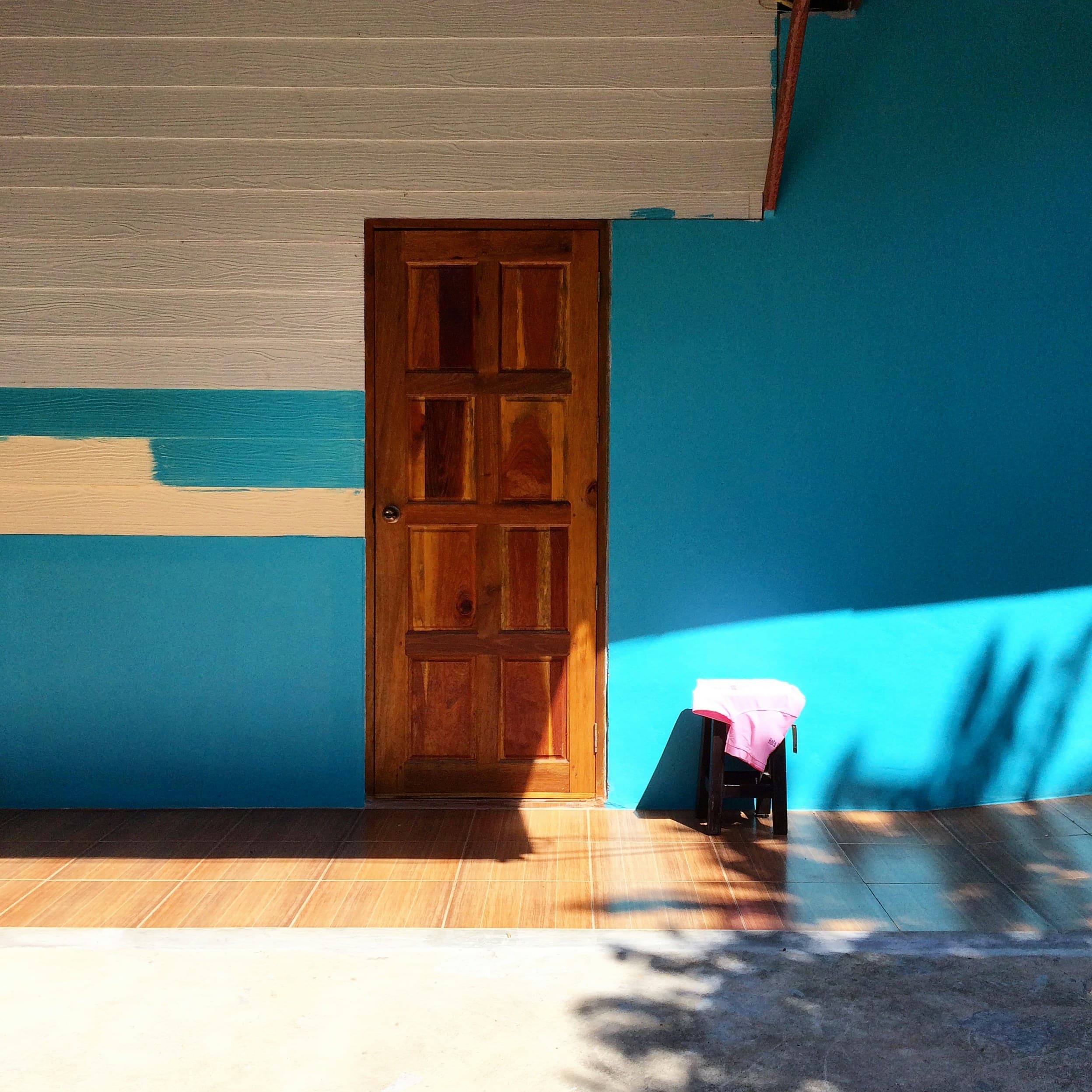 Professional painters working on a stylish exterior facade