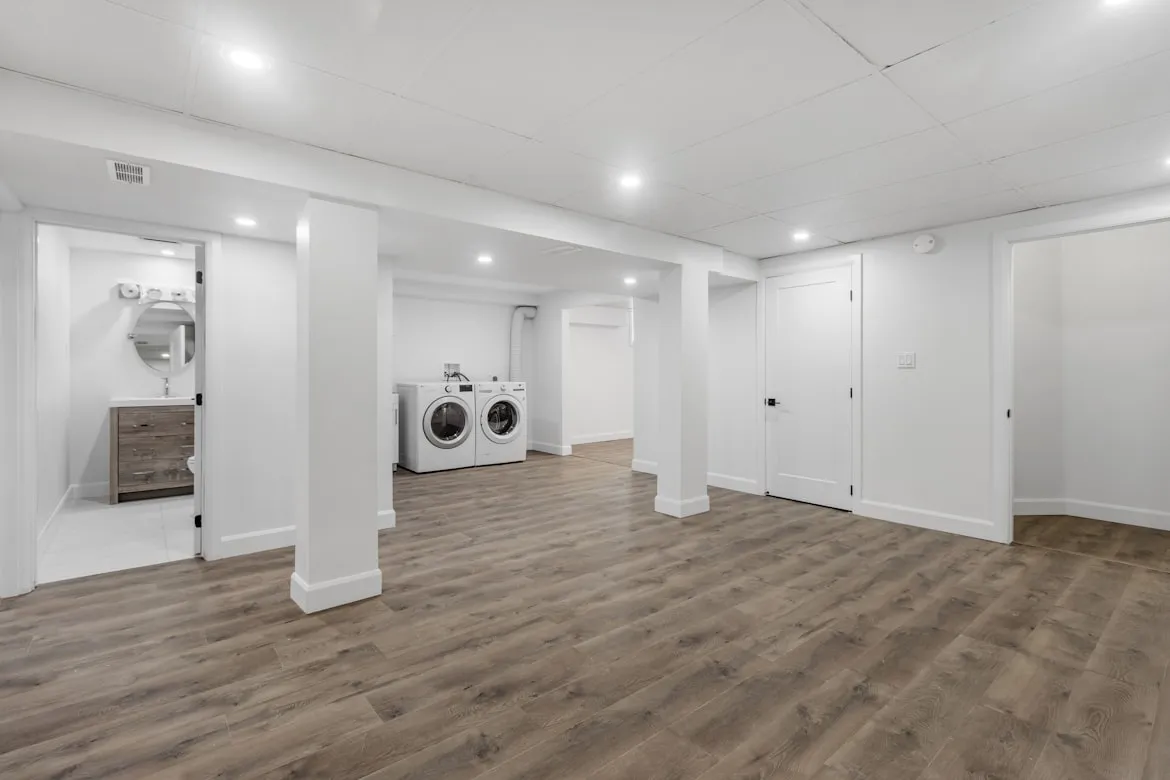 Basement kitchenette and lounge area with modern finishes